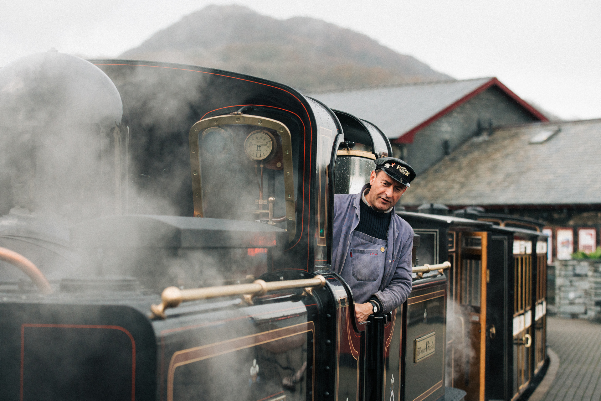 A steam train pulling into the station